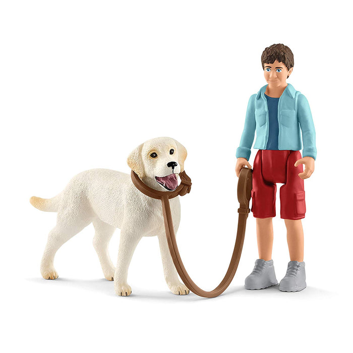 Schleich Boy Walking with Labrador Retriever 42478